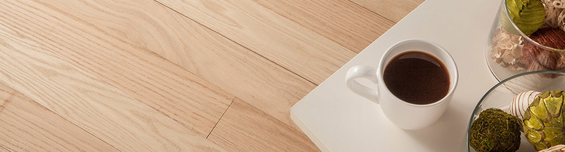 Laying unfinished hardwood floors and finishing them after installation helps maintain the wood's natural characteristics