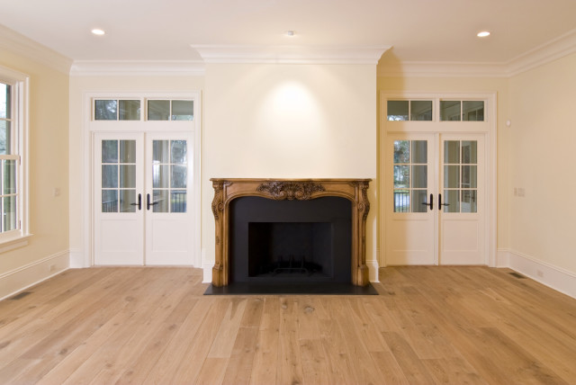 living room fireplace wood floors crown moldings